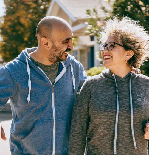 Couple walking together outside on street